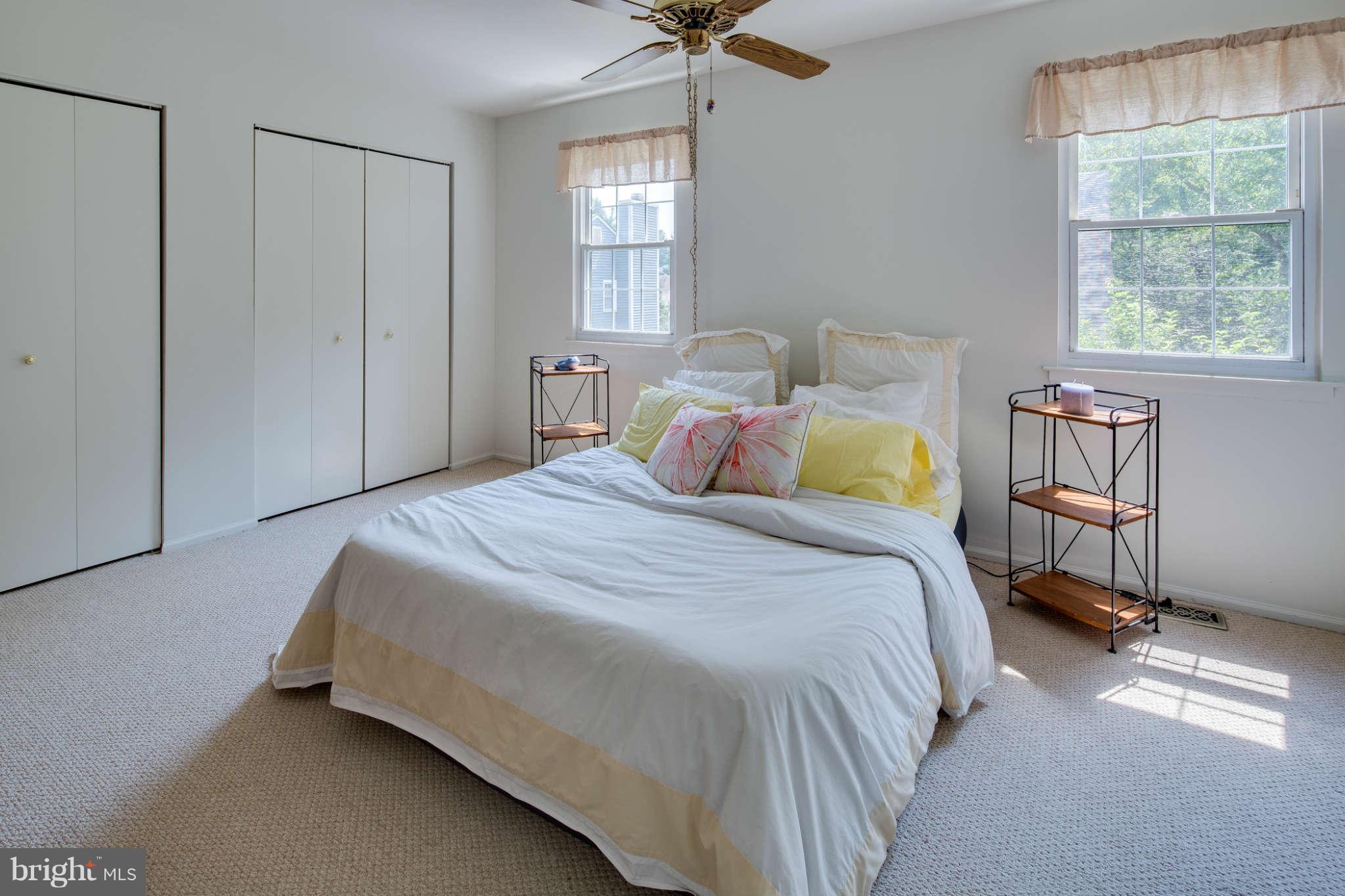 7330 Kindler Road Columbia, MD 21046 - Photo 14 of 28 a bedroom with a bed a window and walk in closet