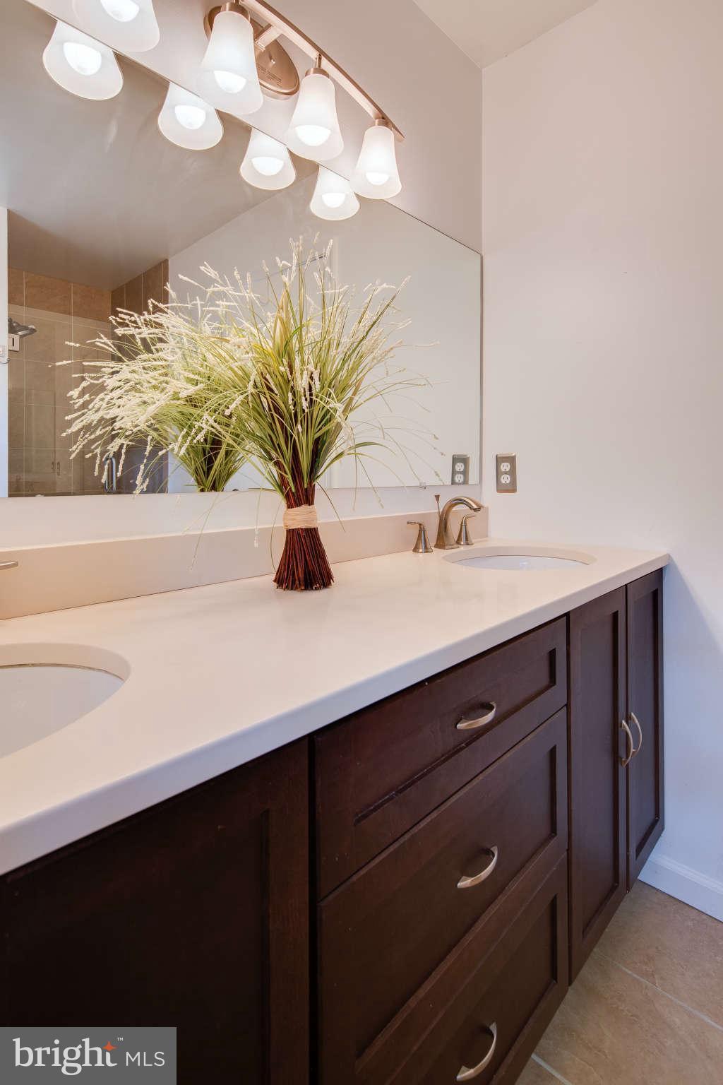 7330 Kindler Road Columbia, MD 21046 - Photo 15 of 28 a bathroom with a sink and a mirror
