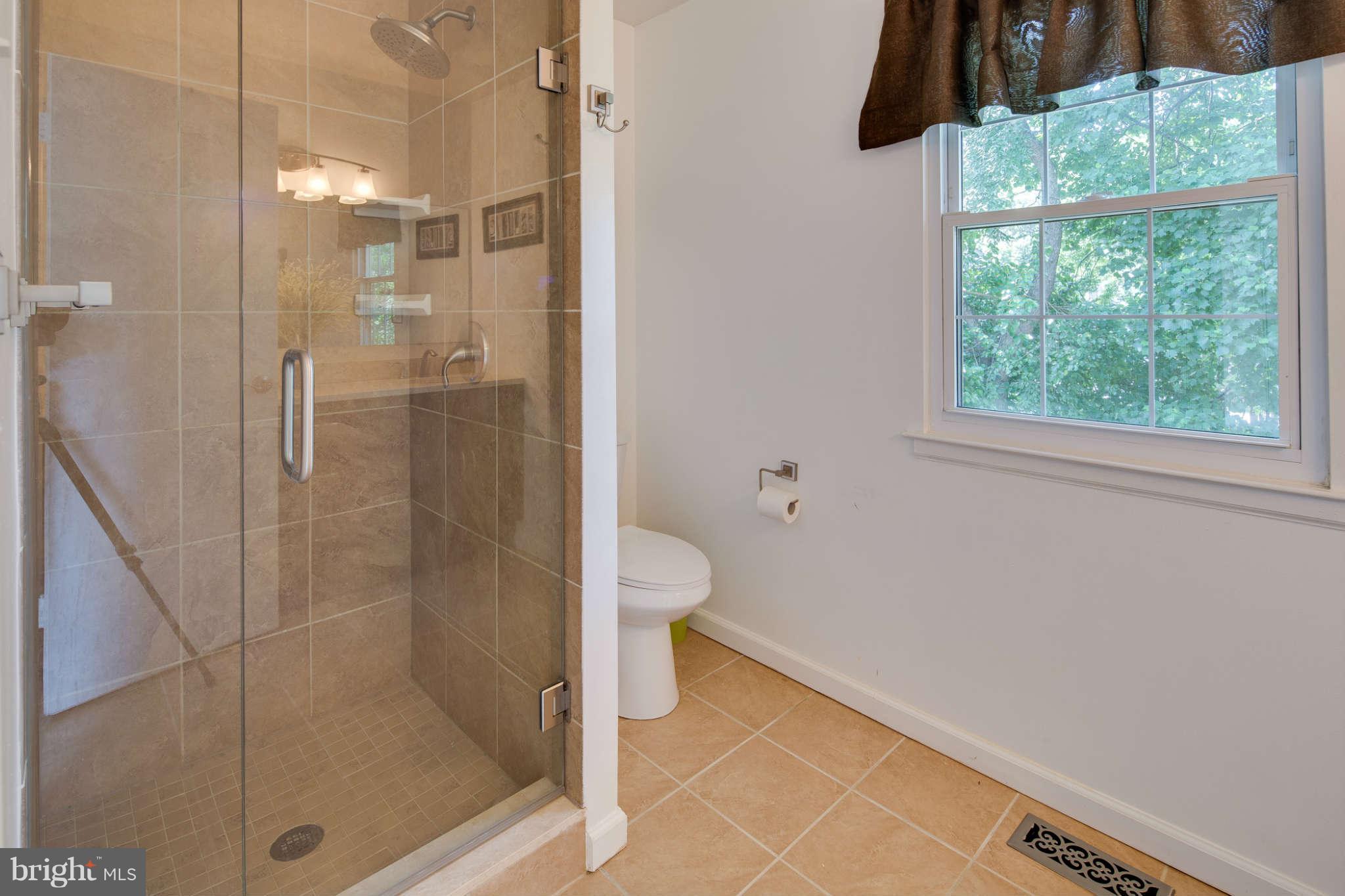7330 Kindler Road Columbia, MD 21046 - Photo 17 of 28 a bathroom with a shower