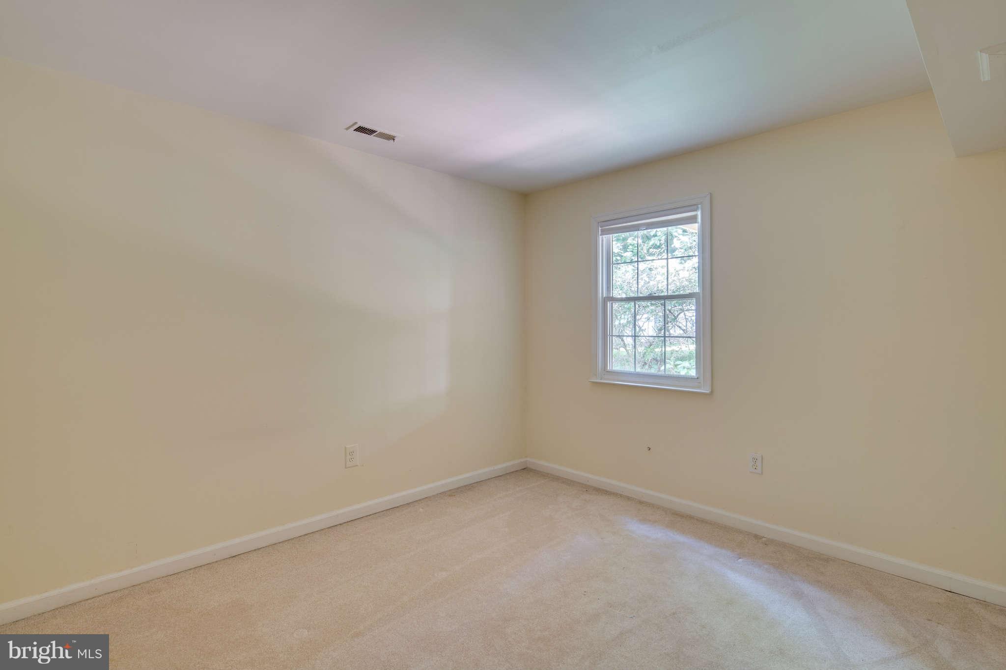 7330 Kindler Road Columbia, MD 21046 - Photo 23 of 28 an empty room with a window