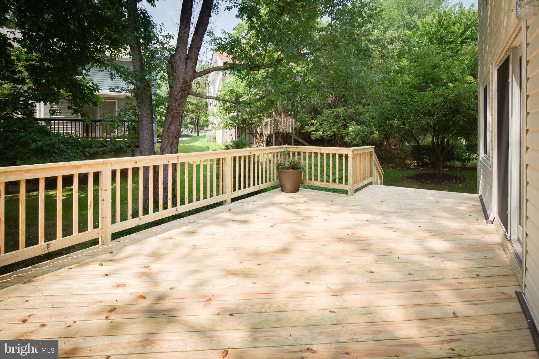 7330 Kindler Road Columbia, MD 21046 - Photo 25 of 28 a view of backyard with deck and trees