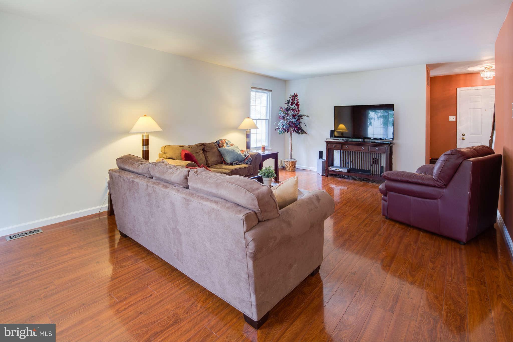 7330 Kindler Road Columbia, MD 21046 - Photo 5 of 28 a living room with furniture and a flat screen tv