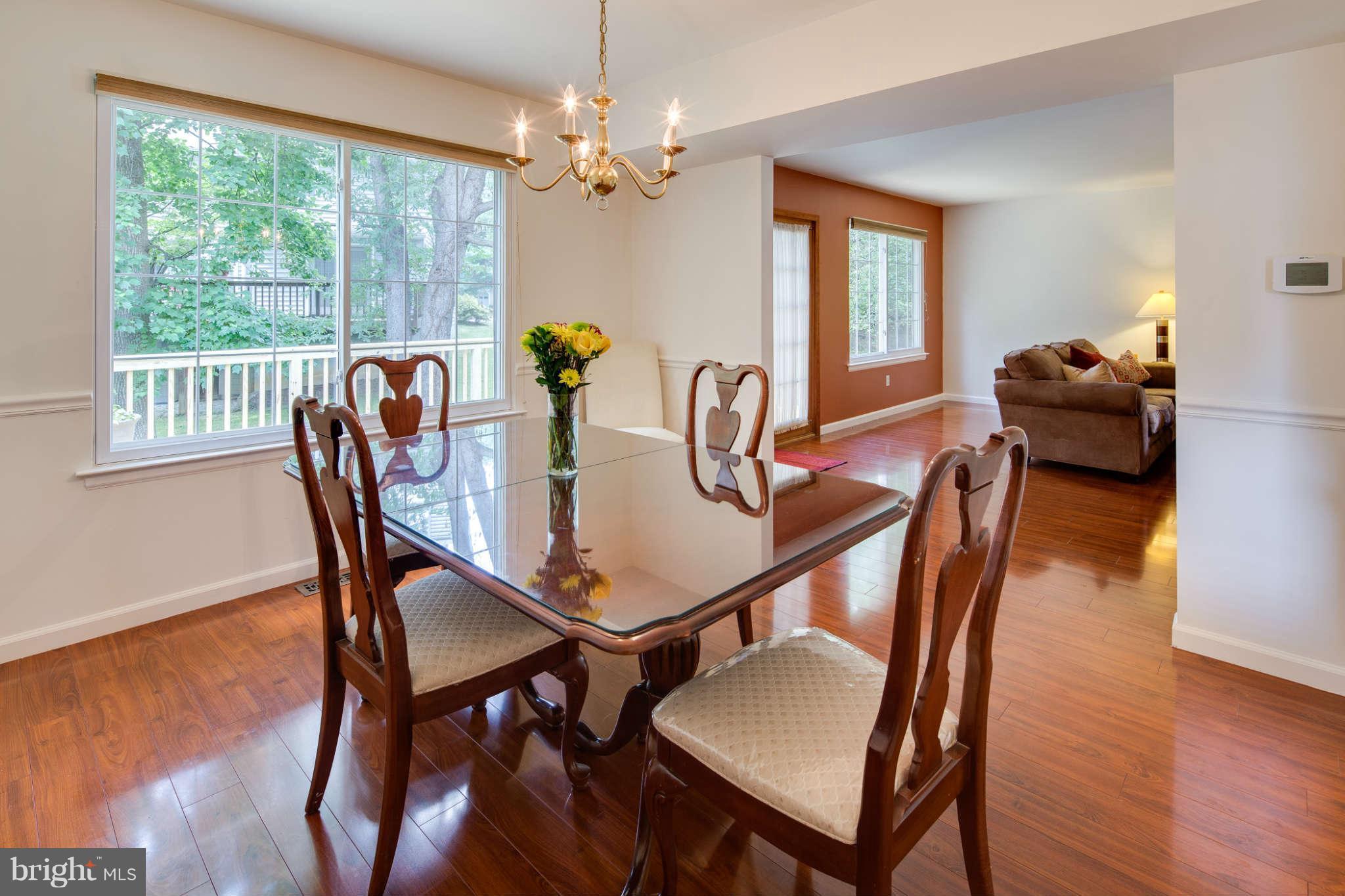 7330 Kindler Road Columbia, MD 21046 - Photo 7 of 28 a view of a dining room with furniture window and wooden floor
