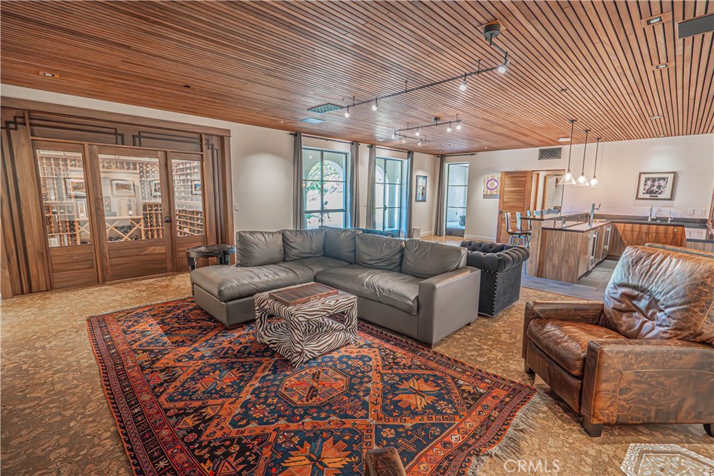 3030 Templeton Road Templeton, CA 93465 - Photo 37 of 75 Searching for the perfect spot to host? This indoor space has it all — a cozy theater, wine cellar, and a bar ready for any gathering. The lower level also offers an office/den and a bathroom with a stunning shower, adding both functionality and luxury.