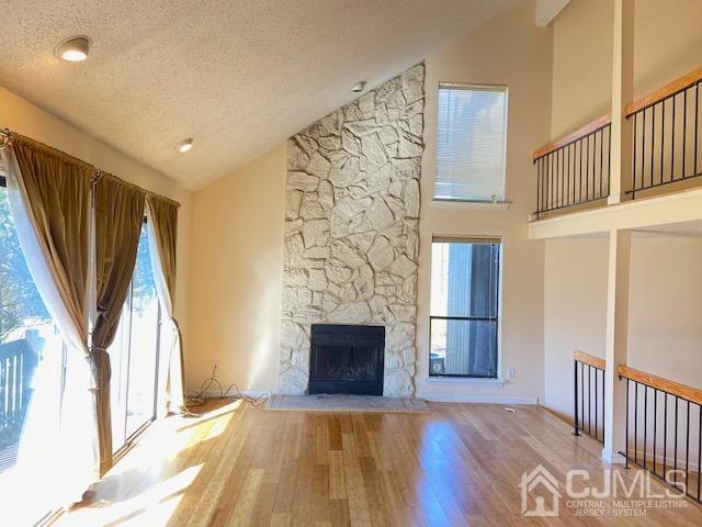 220 Westgate Drive Edison, NJ 08820 - Photo 5 of 19 a view of a livingroom with wooden floor and a fireplace