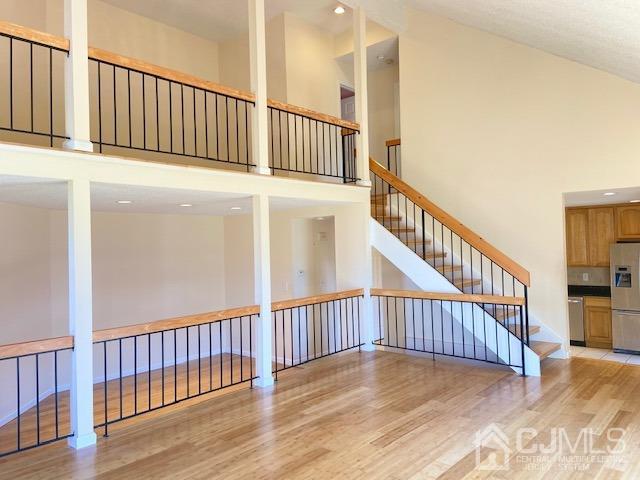 220 Westgate Drive Edison, NJ 08820 - Photo 7 of 19 a view of staircase with railing and a window