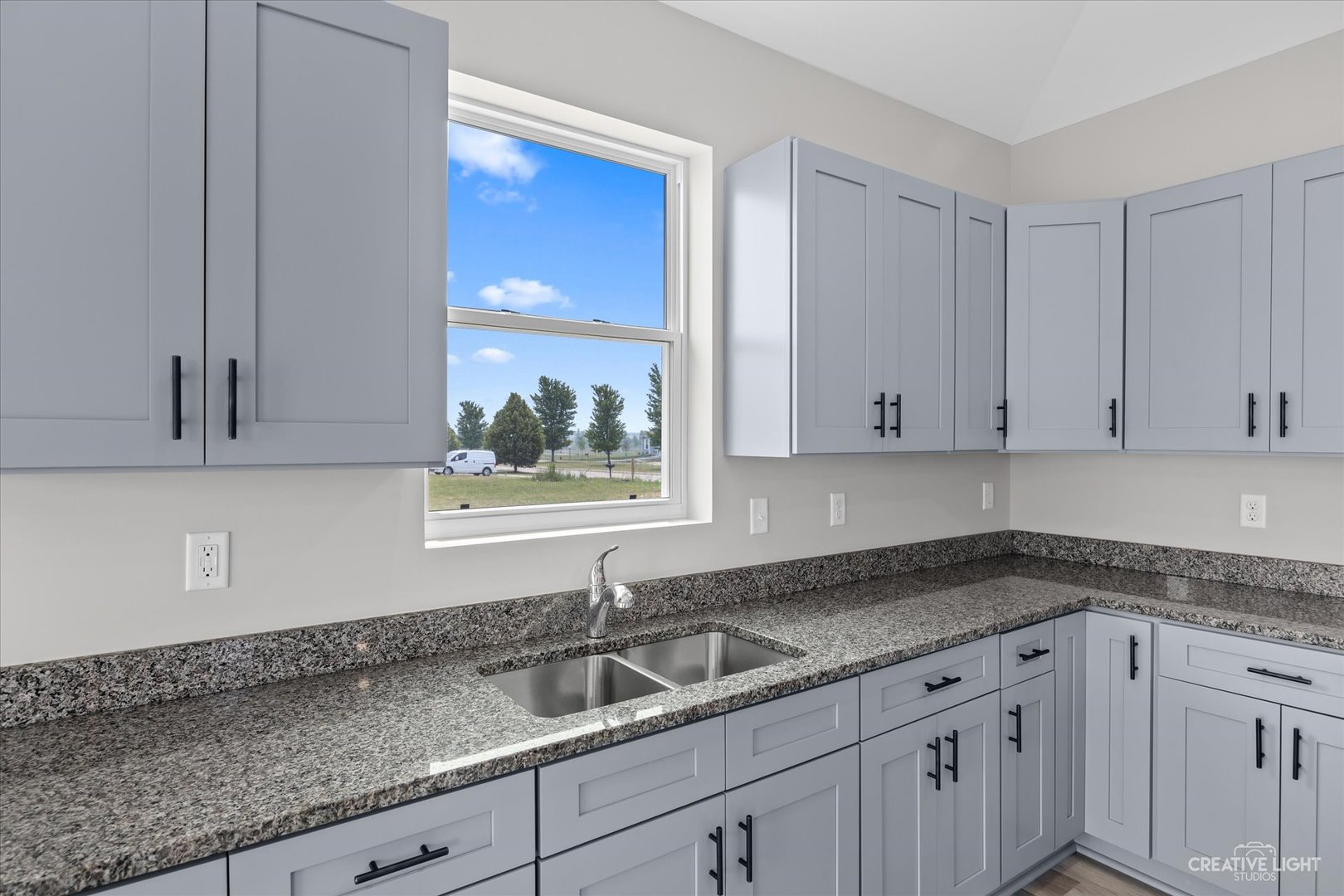 534 Hahn Drive Cortland, IL 60112 - Photo 11 of 32 a kitchen with granite countertop a sink and cabinets