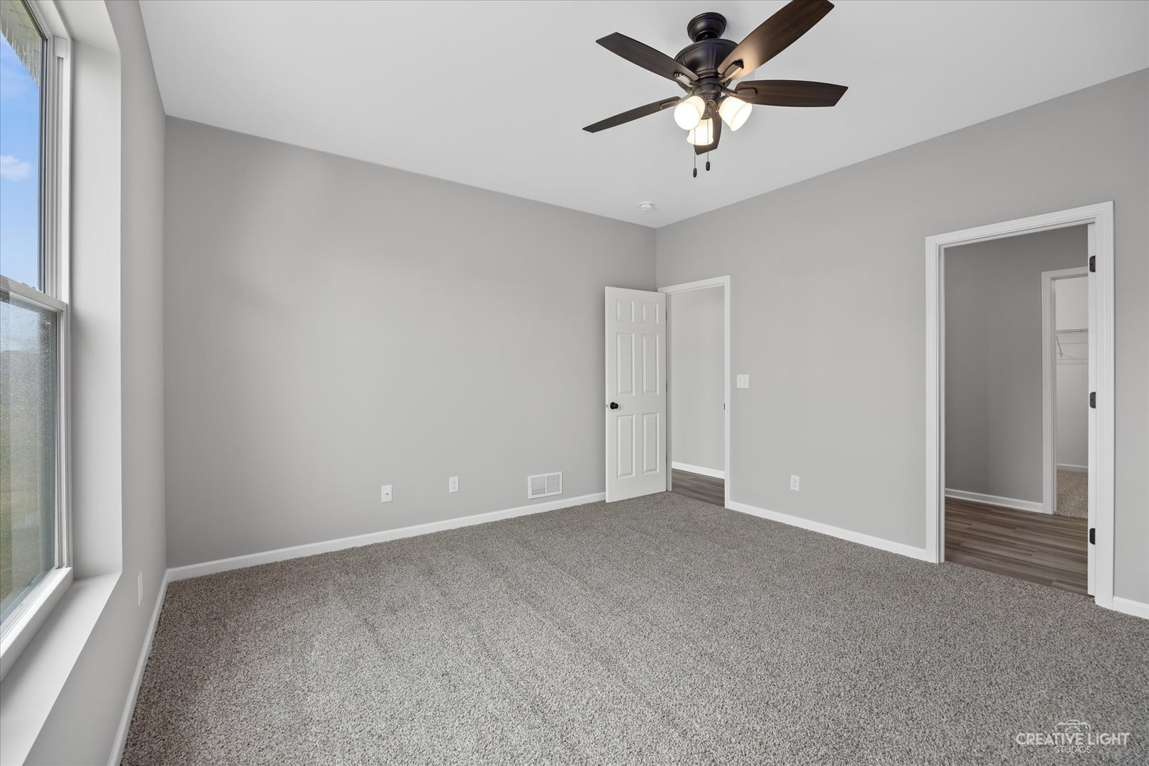 534 Hahn Drive Cortland, IL 60112 - Photo 17 of 32 a view of a room with a ceiling fan and a ceiling fan