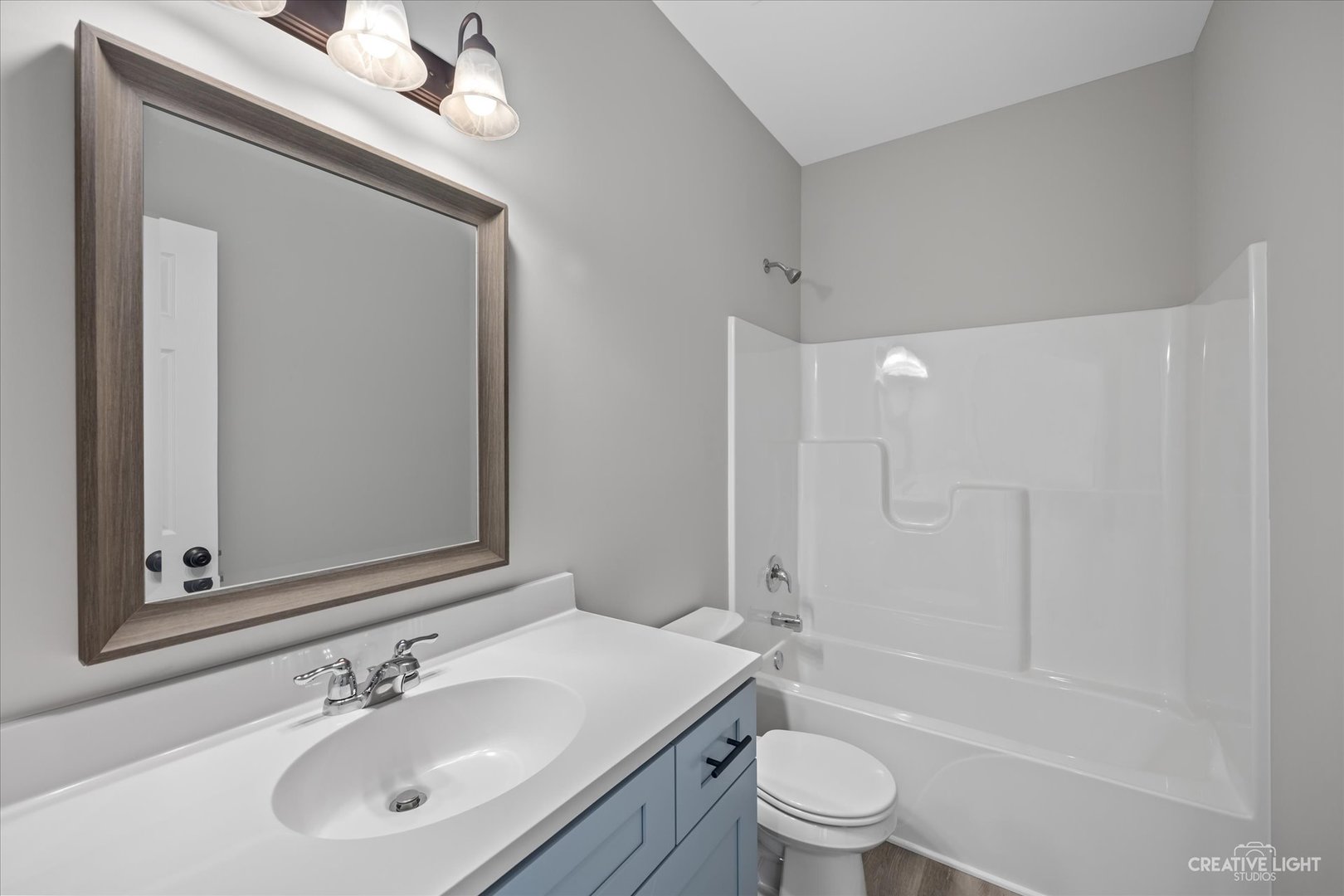 534 Hahn Drive Cortland, IL 60112 - Photo 18 of 32 a bathroom with a sink a toilet and shower