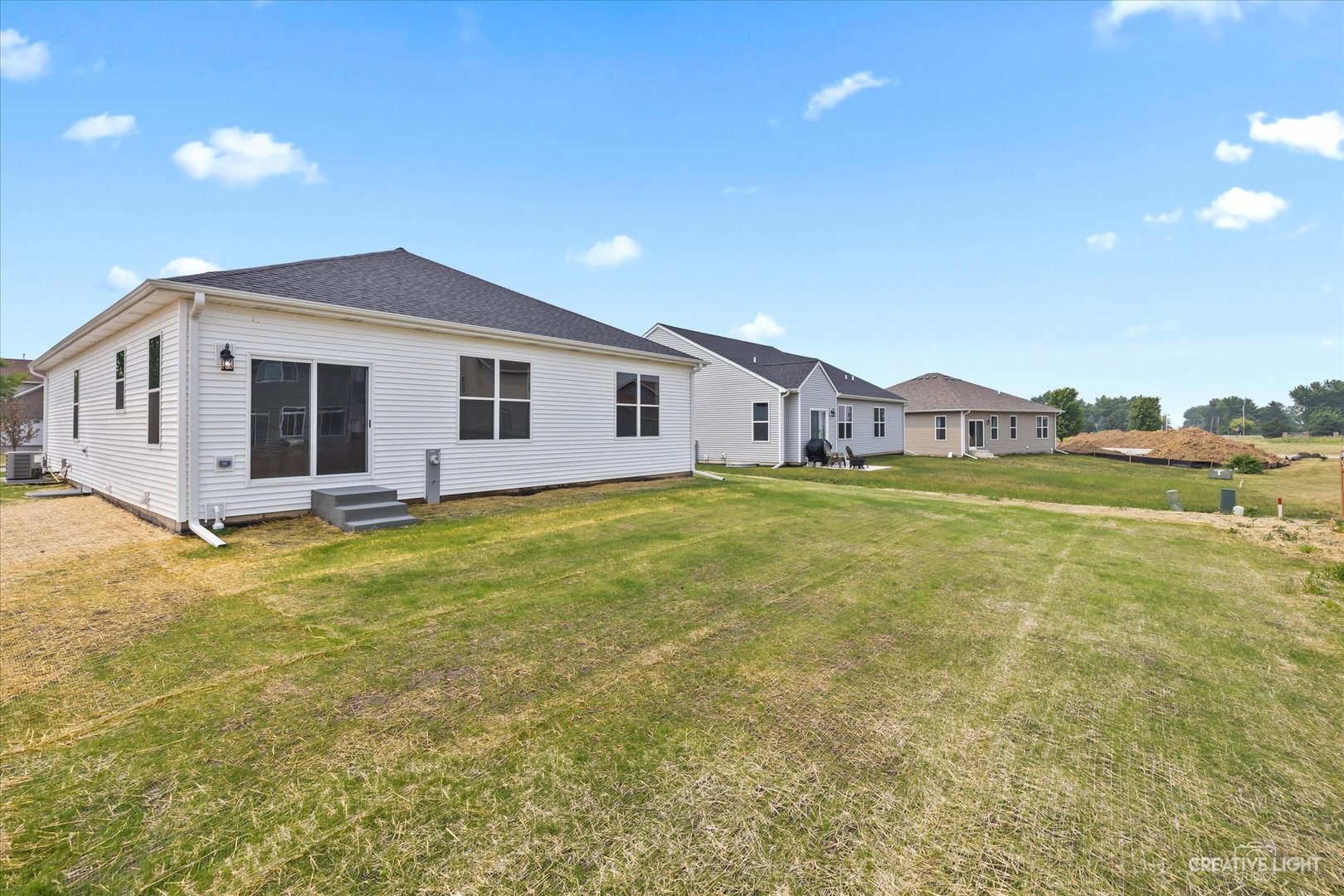 534 Hahn Drive Cortland, IL 60112 - Photo 26 of 32 a view of a house with a big yard