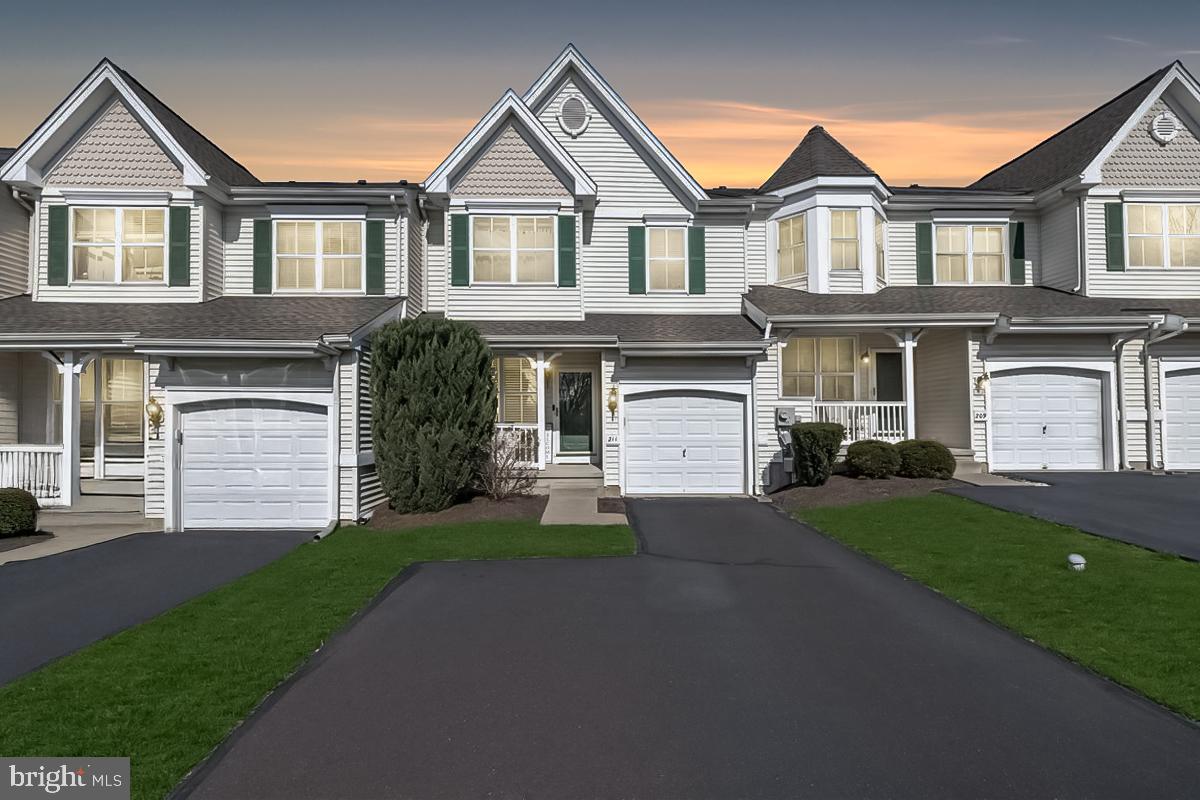211 Barness Lane Chalfont, PA 18914 - Photo 1 of 32 a front view of a house with a yard and garage