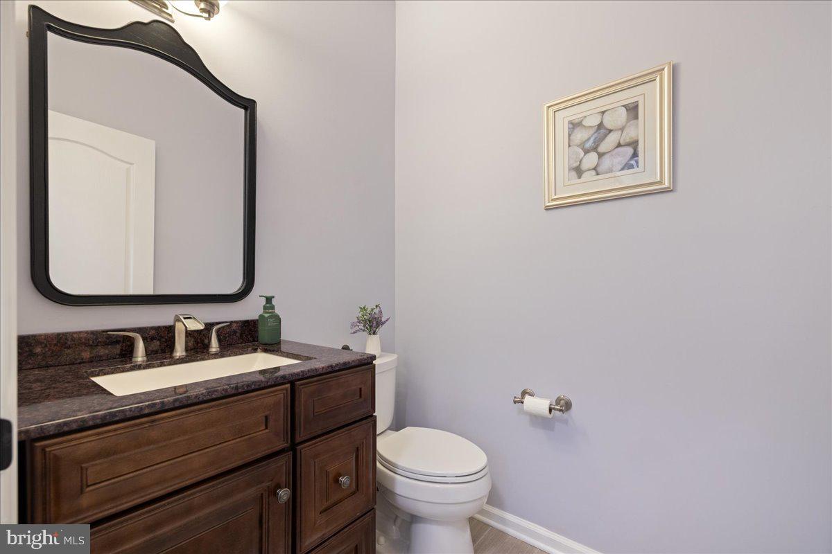 211 Barness Lane Chalfont, PA 18914 - Photo 10 of 32 a bathroom with a toilet sink and mirror