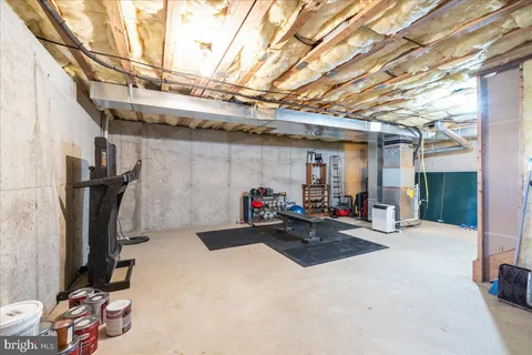 a room with pool table and a flat screen tv