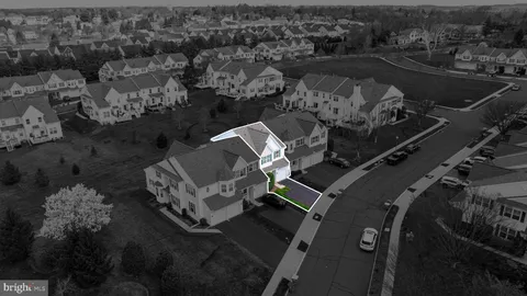 an aerial view of a house with a garden