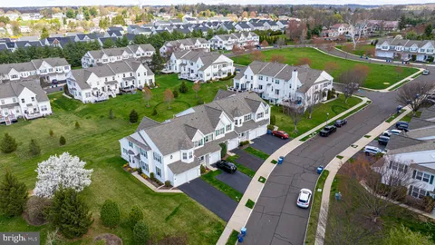 an aerial view of a house with a swimming pool