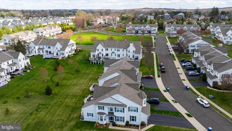 an aerial view of a house with a ocean view