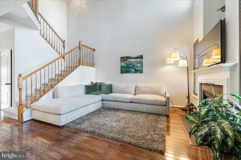 a kitchen with stainless steel appliances granite countertop a refrigerator sink and microwave