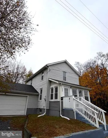 a front view of a house with a porch