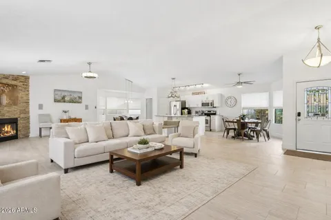 a living room with furniture and a fireplace