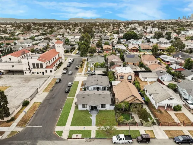 an aerial view of residential houses with outdoor space