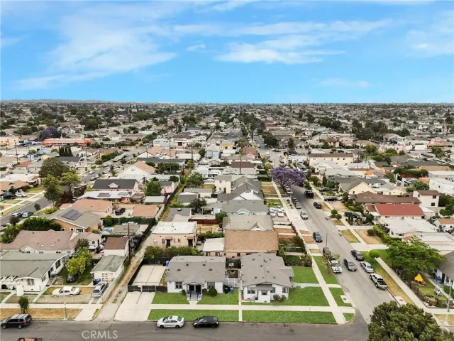 an aerial view of a residential apartment building with a yard