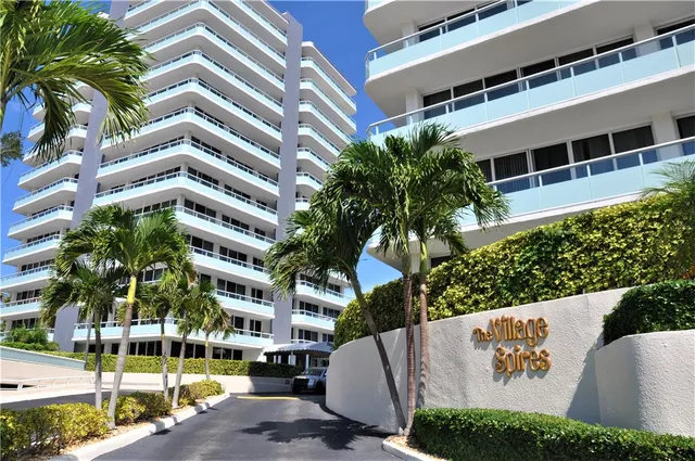 a view of building with yard and staircase