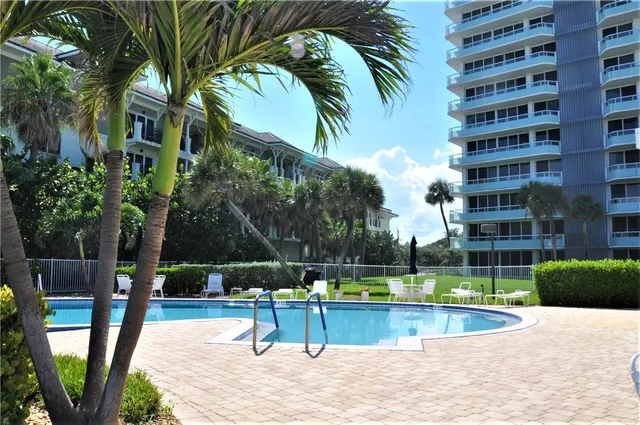 a view of a swimming pool with a patio
