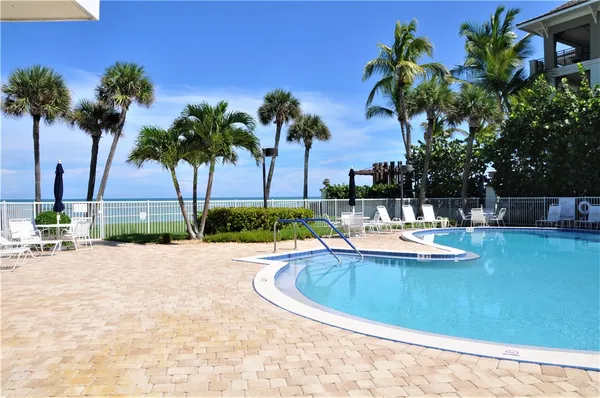 a view of a swimming pool with a house