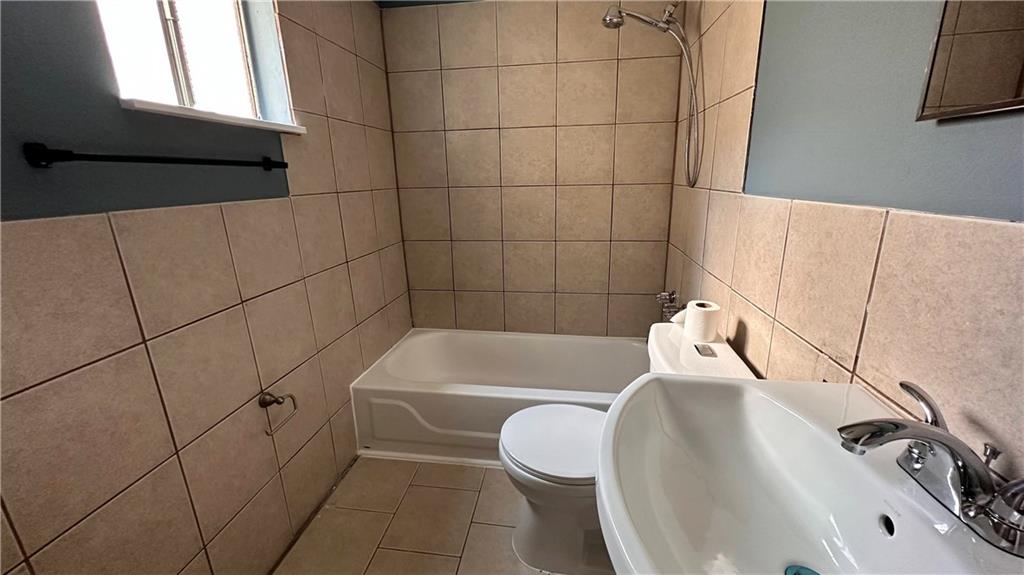 513 52nd Street Pittsburgh, PA 15201 - Photo 11 of 14 a bathroom with a sink a toilet and bathtub