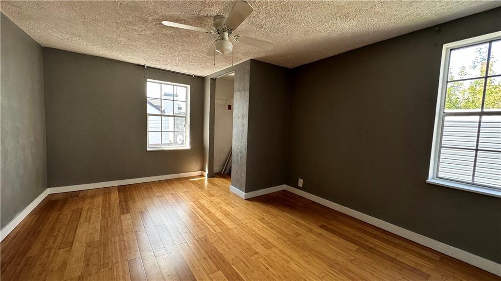 513 52nd Street Pittsburgh, PA 15201 - Photo 13 of 14 a view of an empty room with wooden floor and a window