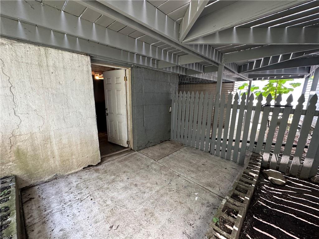 513 52nd Street Pittsburgh, PA 15201 - Photo 4 of 14 a view of a porch with wooden floor and fence