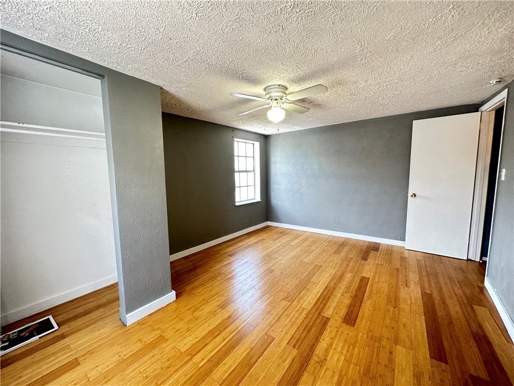 513 52nd Street Pittsburgh, PA 15201 - Photo 6 of 14 wooden floor in an empty room with a window