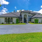 a view of a park that has a tree on the side of it