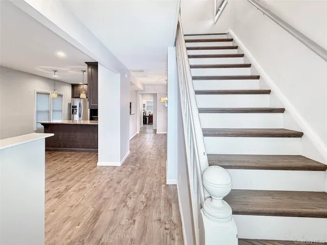 a view of balcony with deck and wooden floor