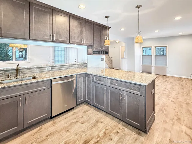 a kitchen with wooden cabinets and white appliances