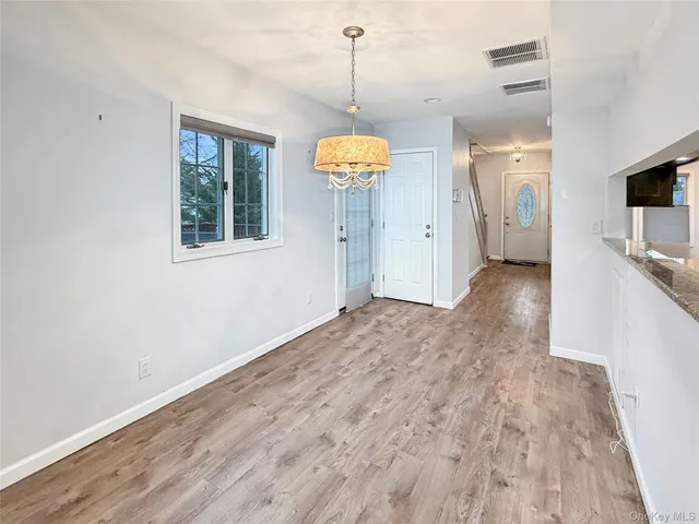 a view of a living room with a flat screen tv