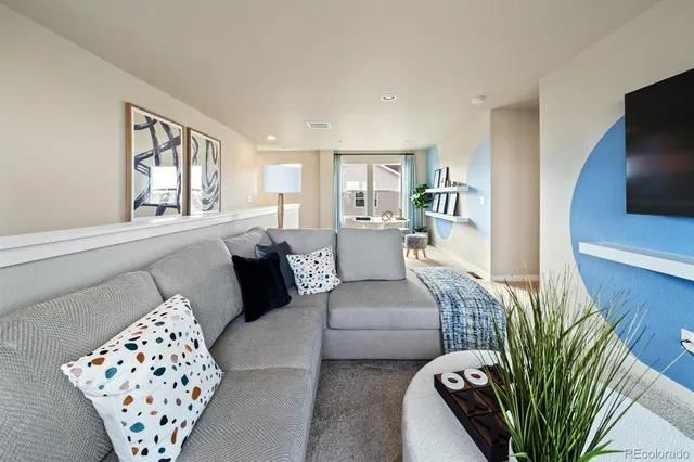 a living room with furniture and a couch