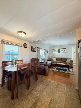 a living room with furniture a window and a table