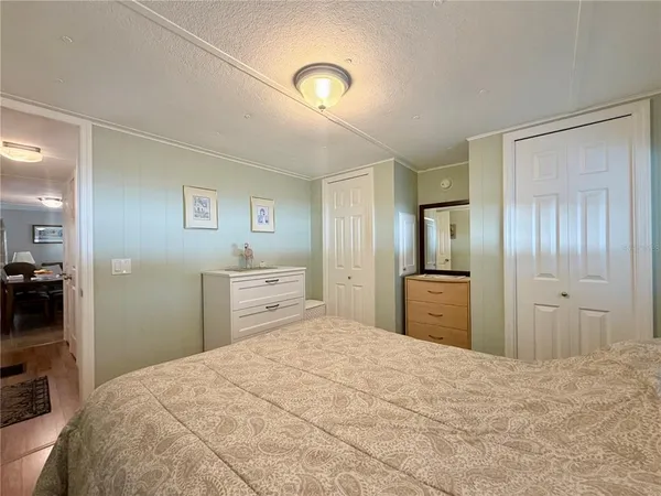 a bedroom with a bed and a view of bathroom