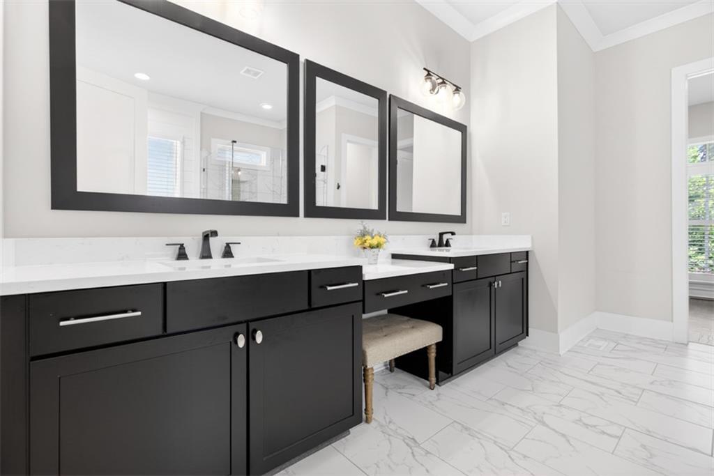 3528 North Bogan Road Buford, GA 30519 - Photo 25 of 79 a bathroom with a sink vanity and mirror