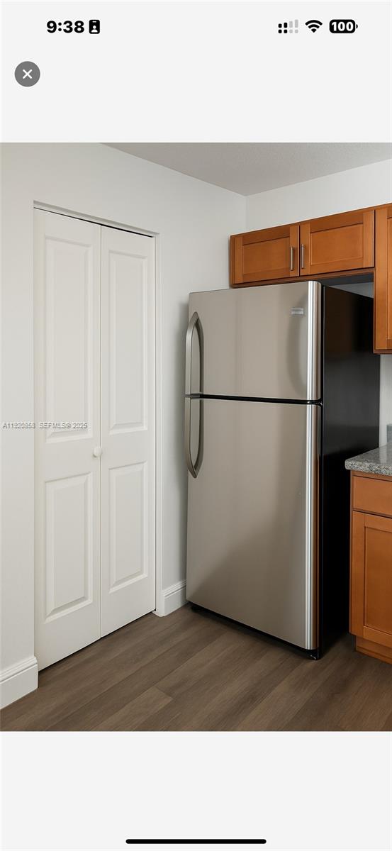 4717 Sable Pine Circle, Unit A2 West Palm Beach, FL 33417 - Photo 5 of 15 a room with a refrigerator
