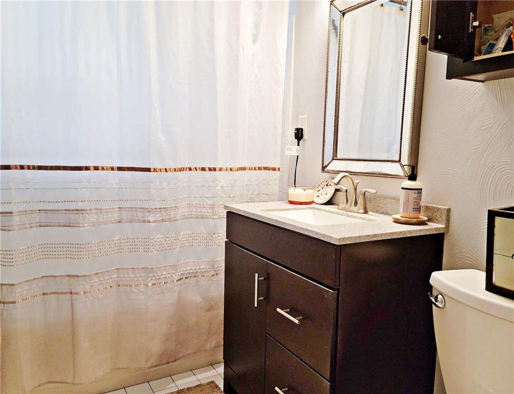 5184 Richland Road Gibsonia, PA 15044 - Photo 14 of 23 a bathroom with a sink and a mirror