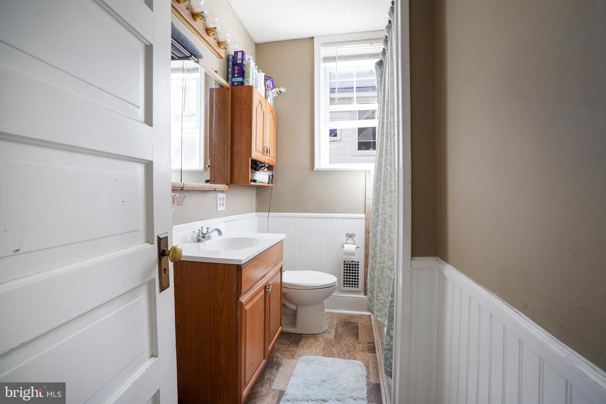 636 North Bend Road Baltimore, MD 21229 - Photo 11 of 26 a bathroom with a sink a toilet and a shower
