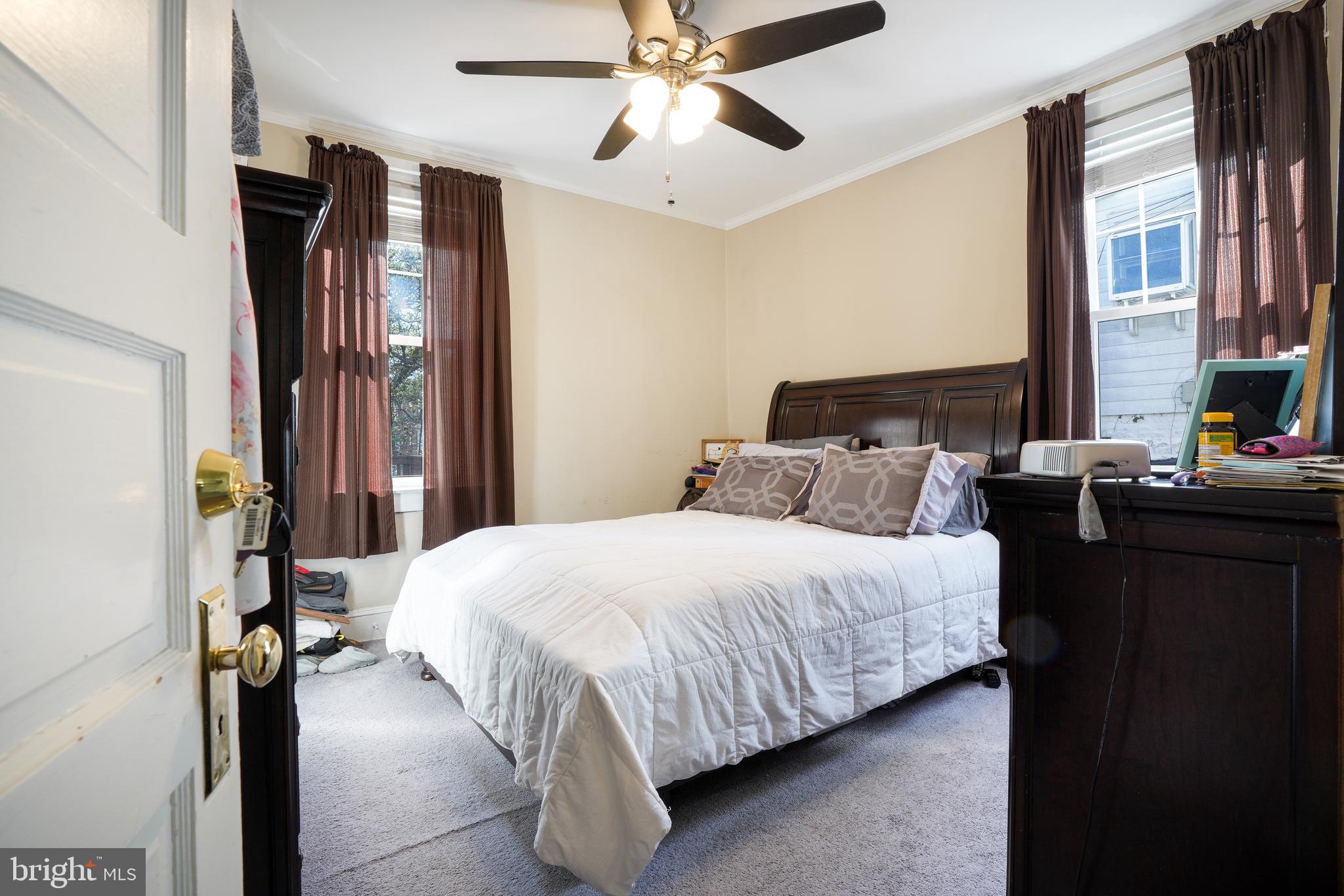636 North Bend Road Baltimore, MD 21229 - Photo 12 of 26 a bedroom with a bed and a chandelier