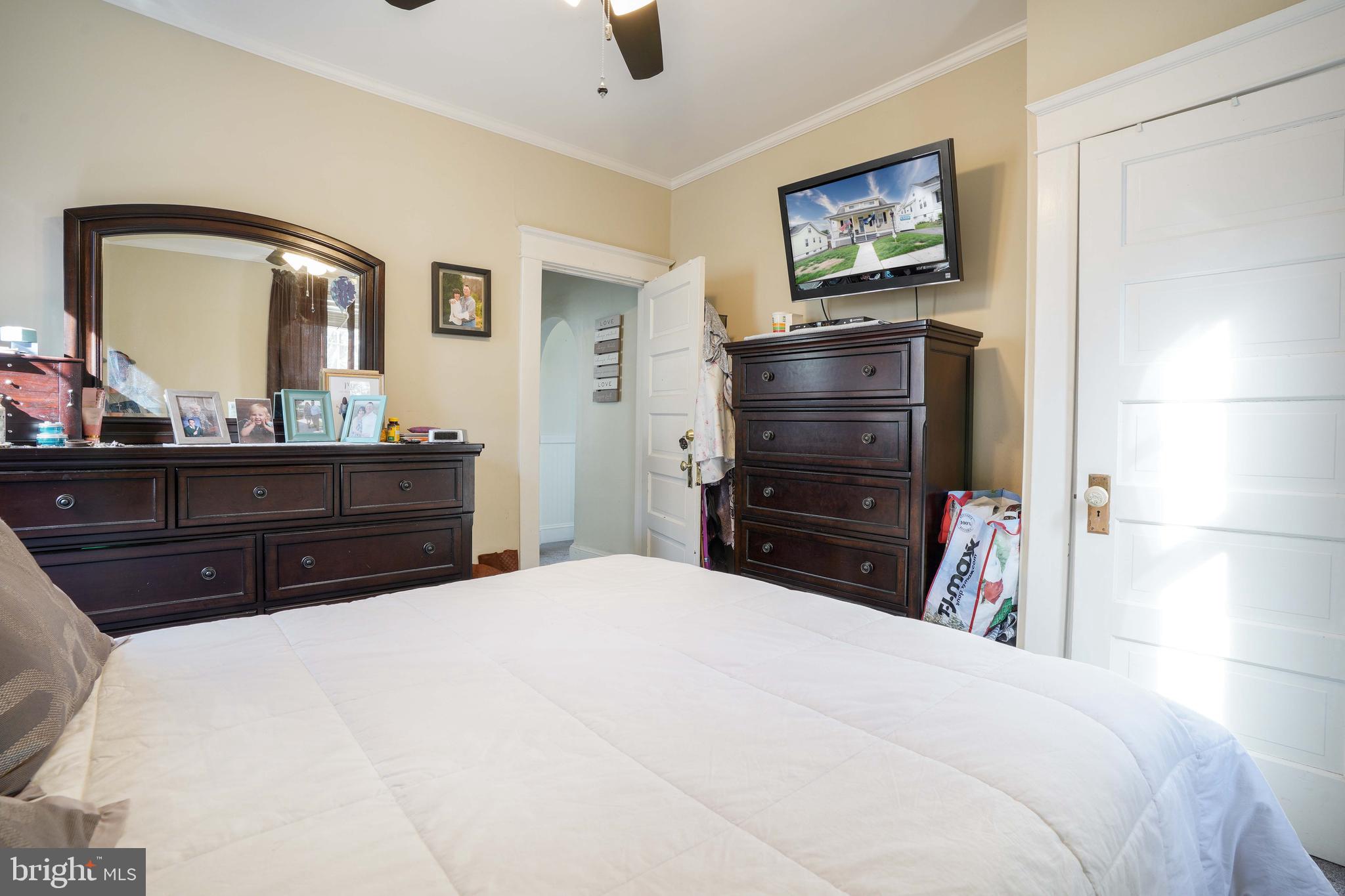 636 North Bend Road Baltimore, MD 21229 - Photo 13 of 26 a bedroom with a bed and a television