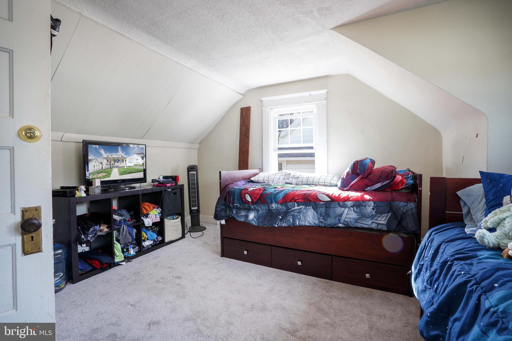 636 North Bend Road Baltimore, MD 21229 - Photo 14 of 26 a bedroom with bed and a window