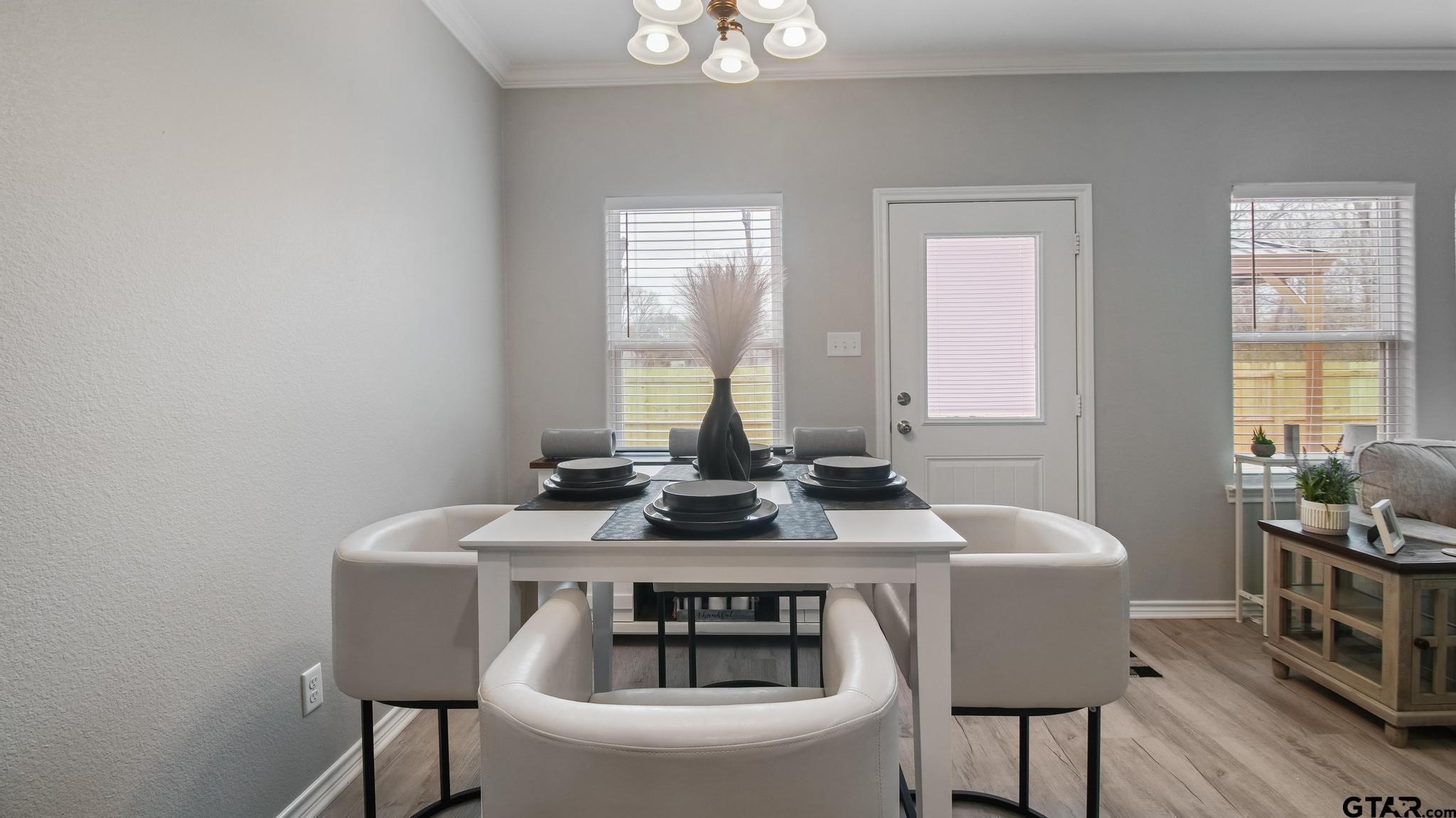 602 North Wofford Street Athens, TX 75751 - Photo 19 of 34 a view of a dining room with furniture and wooden floor