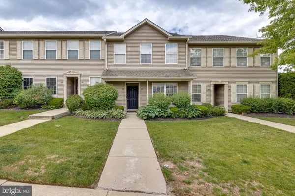 a front view of a house with yard