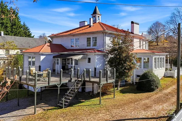 an aerial view of a house with a lake view