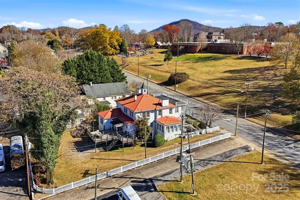 an aerial view of residential house with parking space